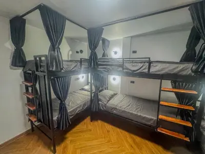 two bunk beds in a room with a mirror at Nordic Hostel I Female Only I Dorms only in Phi Phi Don