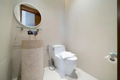a bathroom with a toilet and a mirror at Trendy & Minimalist Design 5BR Pool Villa Trinity C1 in Bang Tao Beach