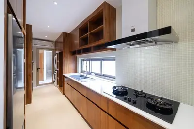 a kitchen with a sink and a stove top oven at Trendy & Minimalist Design 5BR Pool Villa Trinity C1 in Bang Tao Beach