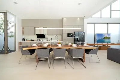 a kitchen and dining room with a wooden table and chairs at Brand-New & Luxury 5BR Pool Villa Trinity C2 in Bang Tao Beach