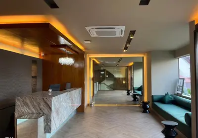 a living room with a couch and a table at Karon Boutique in Karon Beach