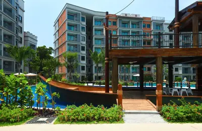 a resort with a swimming pool and buildings at Mountain View Apart Naiyang Beach in Phuket