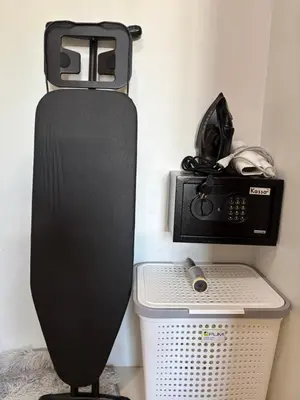 a black speaker and a radio on a wall at Sachi House Stay Near Muay Thai Gym and Beach in Ban Thalat Choeng Thale