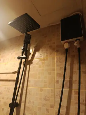 two microphones on the floor in a room at Hop guest House in Patong Beach