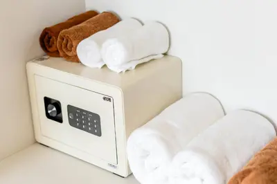 a white toaster with rolled towels on top of it at Sea & Mountain View Private Pool Villa at Aonang Beach in Krabi town