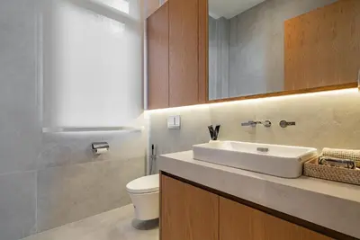 a bathroom with a sink and a toilet at La Vista by Villacarte in Chalong