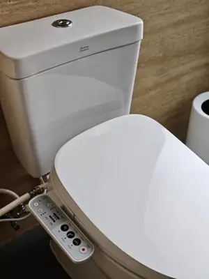 a toilet with a remote control attached to it at Luxury Beachfront BRAHMA Villa 4 Br at Ta-Ke Residence B in Phuket