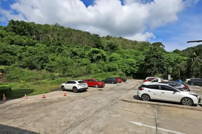 a group of cars parked in a parking lot at Spacious studio near Karon beach by Pro ARK-204 in Phuket Town