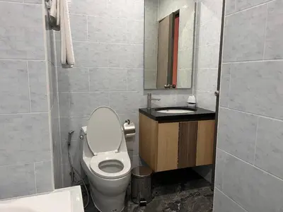 a bathroom with a toilet and a sink at 2 Bedroom Pool Villa in Ban Na Bon