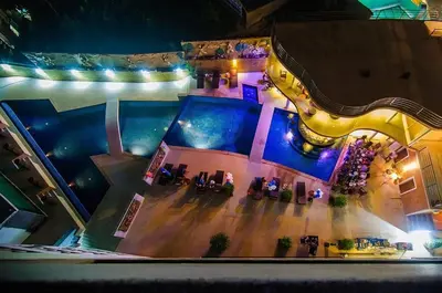 an overhead view of a pool in a building at Large, Quiet Corner Condo in Patong Beach