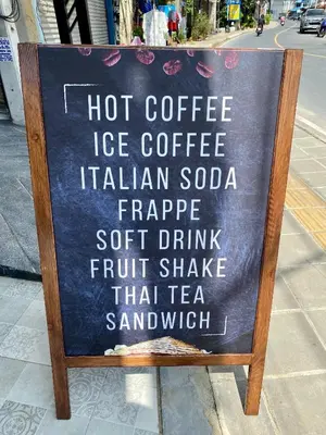 a sign for a hot coffee ice coffee italian soda sidx sidx sidx sidx at Mildmint มายมิ้นท์อพาร์ทเม้นท์ Self Serviced in Kata Beach