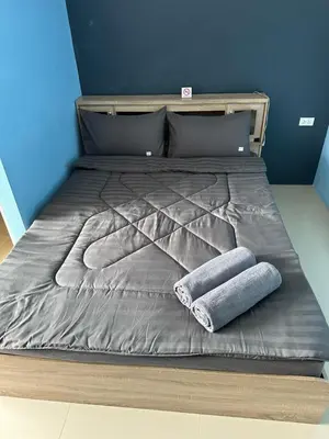 a large bed with two pillows on top of it at Mildmint มายมิ้นท์อพาร์ทเม้นท์ Self Serviced in Kata Beach