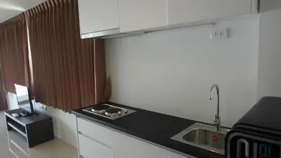 a kitchen with a sink and a counter top at Large, quiet Condo by รินดา Rinrada in Patong Beach