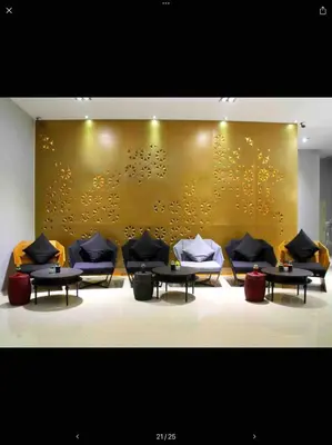 a room with couches and tables and a gold wall at Penthouse Seaview poolview 140sqm panoramic B43 in Kamala Beach