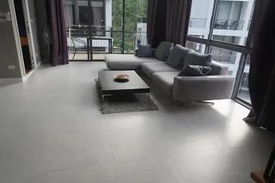 a living room with a couch and a coffee table at Penthouse Seaview poolview 140sqm panoramic B43 in Kamala Beach