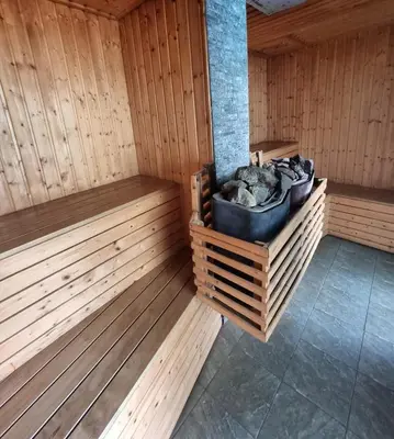 a sauna with wooden floors and a black bucket at Penthouse Seaview poolview 140sqm panoramic B43 in Kamala Beach