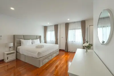 a white bedroom with a bed and a mirror at V154 Built December 2024 Oasis Great Villa Beautiful in Chalong