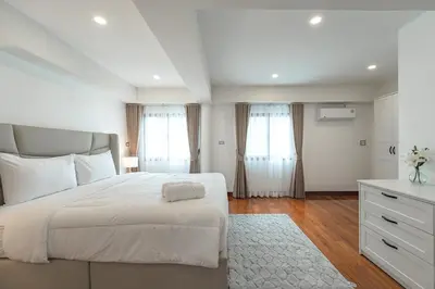 a white bedroom with a large bed and a dresser at V154 Built December 2024 Oasis Great Villa Beautiful in Chalong