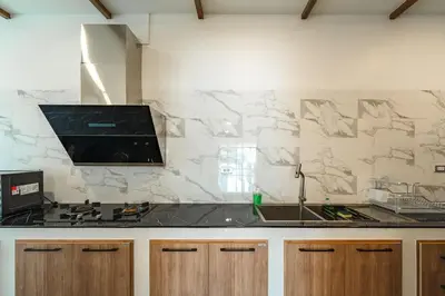 a kitchen with a counter top and a marble wall at V154 Built December 2024 Oasis Great Villa Beautiful in Chalong