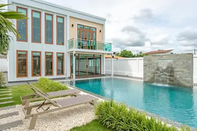 a house with a swimming pool next to a building at V154 Built December 2024 Oasis Great Villa Beautiful in Chalong