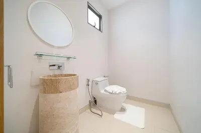 a bathroom with a toilet and a mirror at Elite Living - Design 3BR Pool Villa in Newly Built LuxPride 4 L6 Residence in Bang Tao Beach