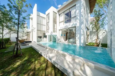 an exterior view of a house with a swimming pool at Elite Living - Design 3BR Pool Villa in Newly Built LuxPride 4 L6 Residence in Bang Tao Beach