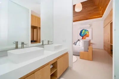 a bathroom with two sinks and a living room at Elite Living - Design 3BR Pool Villa in Newly Built LuxPride 4 L6 Residence in Bang Tao Beach