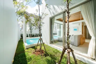 a room with a view of a pool and a house at Exclusive New Build - Designer 3BR Pool Villa in Prestigious LuxPride 4 L7 Residence in Bang Tao Beach