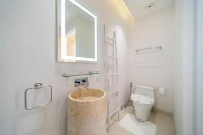 a bathroom with a toilet and a window at Exclusive New Build - Designer 3BR Pool Villa in Prestigious LuxPride 4 L7 Residence in Bang Tao Beach