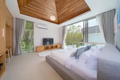 a bedroom with a large bed and a large window at Exclusive New Build - Designer 3BR Pool Villa in Prestigious LuxPride 4 L7 Residence in Bang Tao Beach