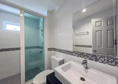a bathroom with a sink and a shower and a toilet at Luxury Residence in Phuket Center in Phuket Town