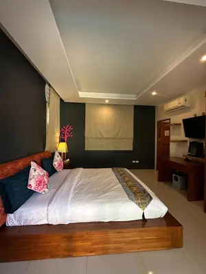 a bedroom with a large bed in a room at 4Bedroom Villa with Private Pool in Ban Klang