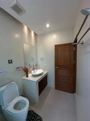 a bathroom with a toilet and a sink at 4Bedroom Villa with Private Pool in Ban Klang