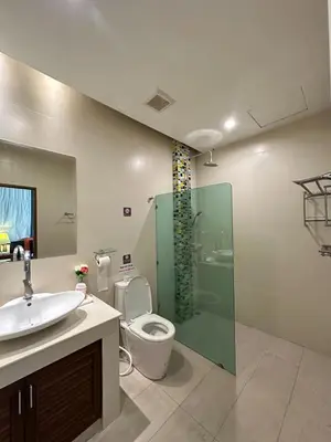 a bathroom with a toilet and a sink and a shower at 4Bedroom Villa with Private Pool in Ban Klang