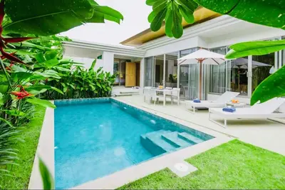 a swimming pool in the backyard of a villa at Trichada Sky 3bed villa, Bangtao, Laguna in Phuket