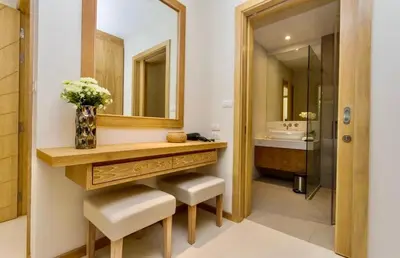 a bathroom with a vanity with a mirror and a sink at Trichada Sky 3bed villa, Bangtao, Laguna in Phuket