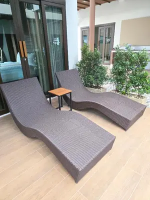 two chairs and a table in a building at Blue Palm Residence Kata in Kata Beach