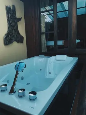 a bathroom with a white sink with a mushroom on it at Thiwson Beach Resort - SHA Extra Plus in Ko Yao Yai