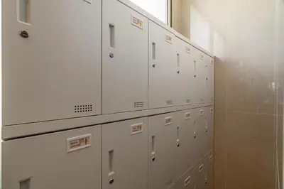 a row of white lockers in a room at AZ Sunrise Resort & Fitness Club in Layan Beach