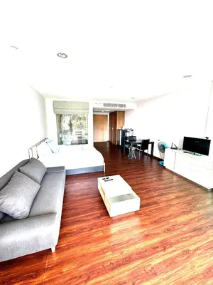 a living room with a couch and a table at Ark Studio only 10 Minutes from kataKaron Beach in Karon Beach