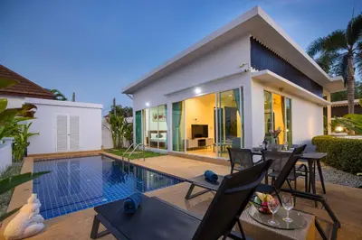 a villa with a swimming pool and a house at Relaxing Holidays - 2BR Private Pool Villa Greens 8, Rawai in Rawai Beach