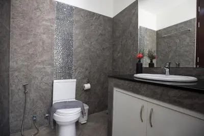 a bathroom with a toilet and a sink at Relaxing Holidays - 2BR Private Pool Villa Greens 8, Rawai in Rawai Beach