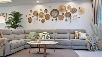 a living room with a couch and a table at Cozy family townhouse in Chalong
