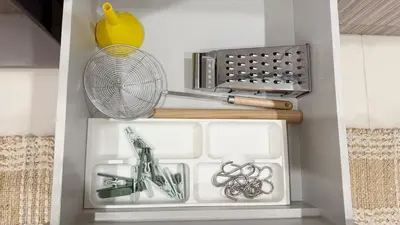 a refrigerator with a fan and other kitchen items at Cozy family townhouse in Chalong