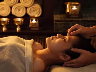 a woman getting a massage in a spa room at Songbird Suites - Deluxe King Suite and Scooter in Ao Nang Beach