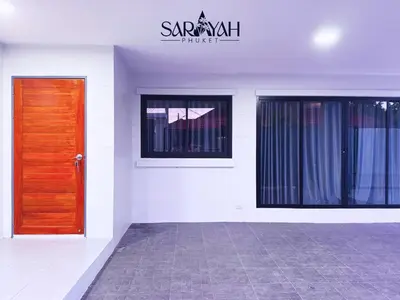a building with a door and a sign that reads sarikrit house at Sarayah Phuket 4Bed Villa in Ban Tha Rua
