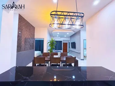 a dining room with a table and chairs at Sarayah Phuket 4Bed Villa in Ban Tha Rua