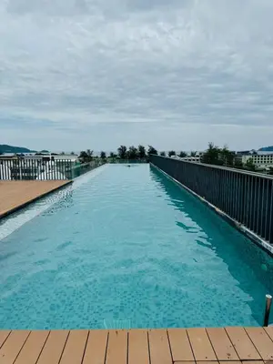 a large swimming pool on top of a building at Patong rooftop Pool luxury Condo with Bathtub and sofa bed big balcony in Patong Beach