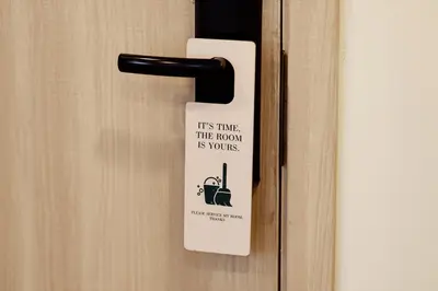 a tag on a door with a sign on it at Palmetto Park Residence in Karon Beach