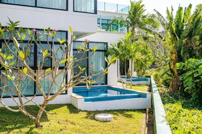 a house with a swimming pool in the yard at Sunny Stay A8 Charming Residence Close to Nature in Kamala Beach